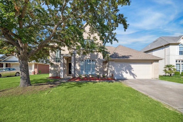 view of front facade with a front yard and a garage