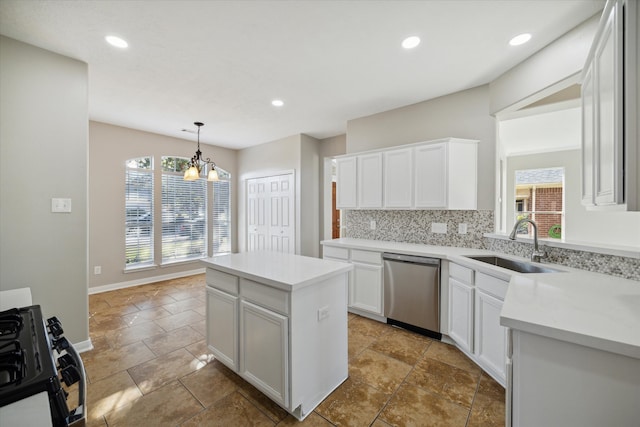 kitchen with white cabinets, sink, stainless steel dishwasher, a center island, and decorative backsplash