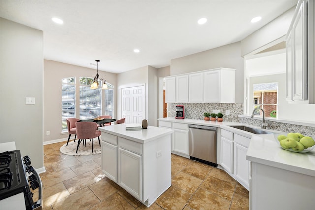 kitchen with hanging light fixtures, sink, backsplash, white cabinetry, and dishwasher