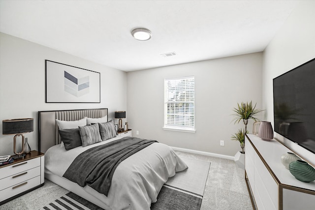 bedroom with light colored carpet