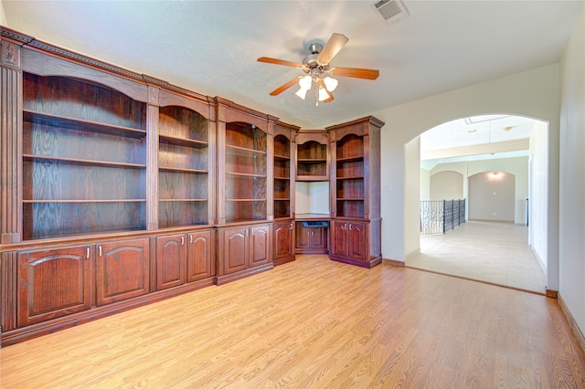 unfurnished office featuring ceiling fan and light hardwood / wood-style flooring