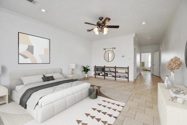 bedroom with ceiling fan and crown molding