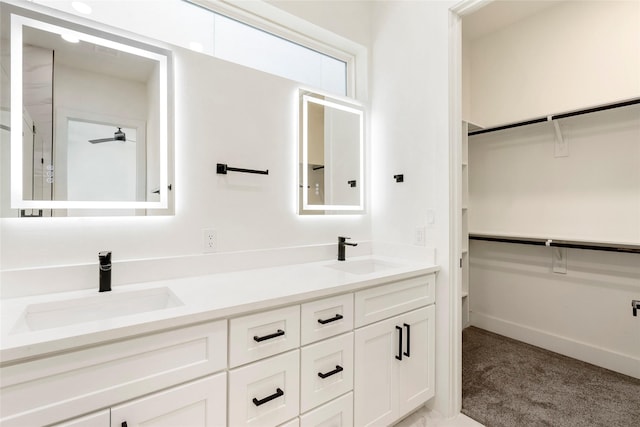 bathroom featuring vanity and ceiling fan