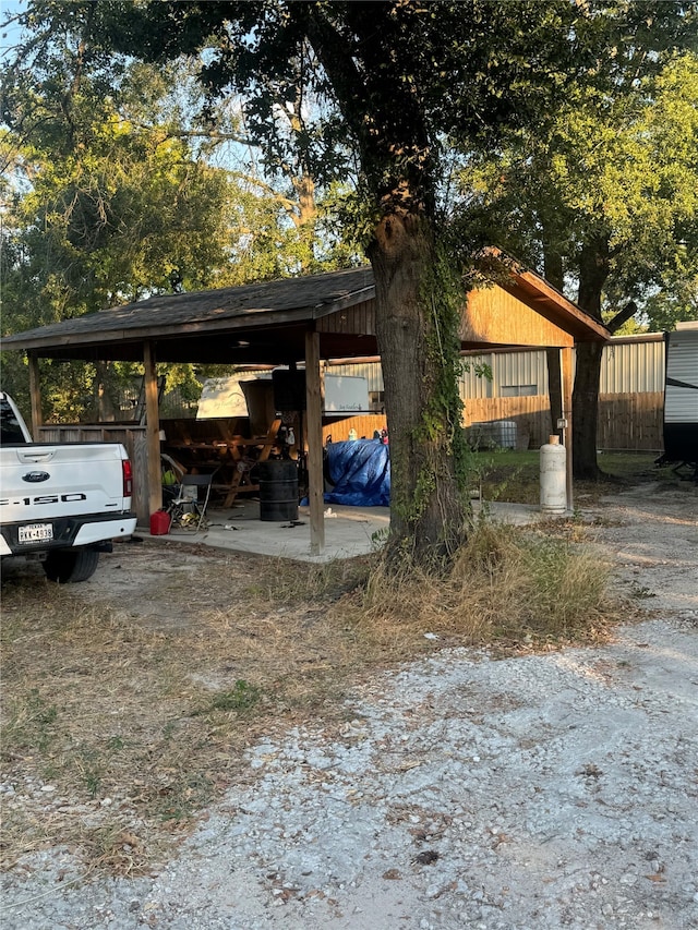 exterior space featuring a carport