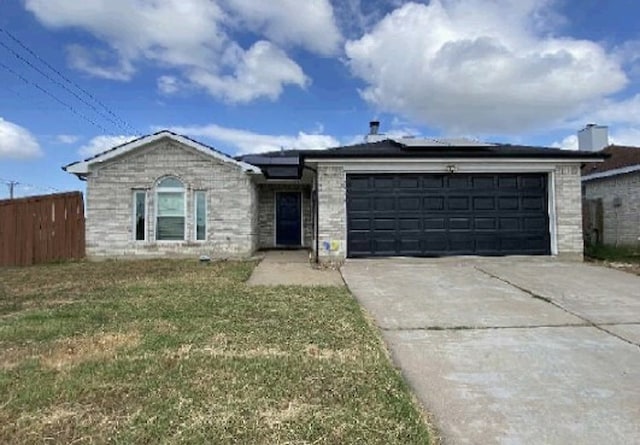 single story home with a front yard and a garage