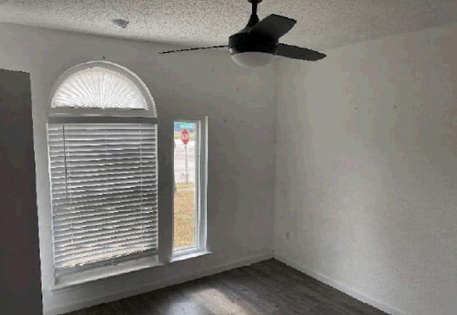 7432 Ashbourne Way, Fort Worth, TX 76133 - empty room featuring wood finished floors, a textured ceiling, a ceiling fan, and baseboards