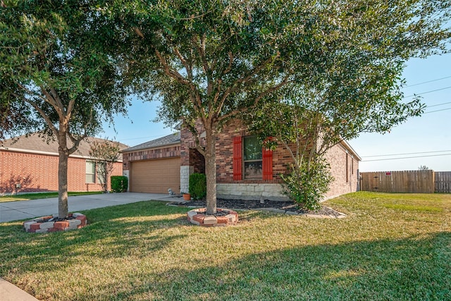 view of front of property featuring a front lawn and a garage