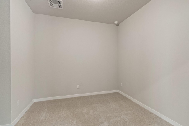 unfurnished room featuring carpet flooring