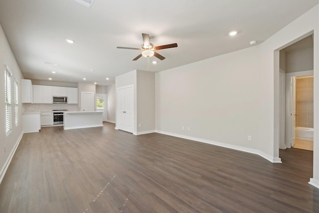 unfurnished living room with hardwood / wood-style floors and ceiling fan