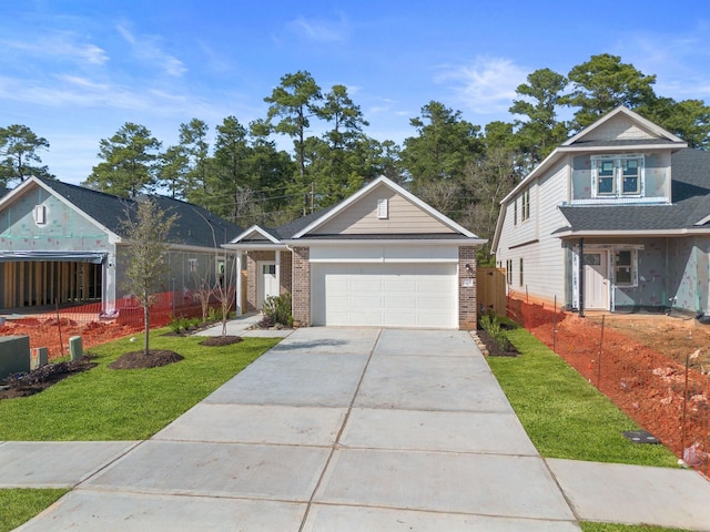 view of front of house with a front lawn and a garage