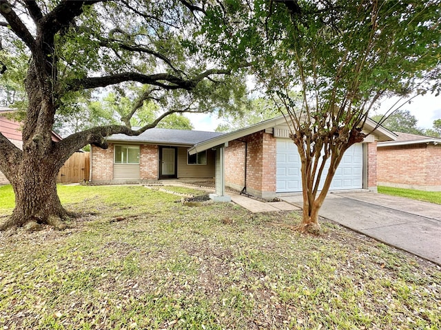 single story home with a front lawn and a garage