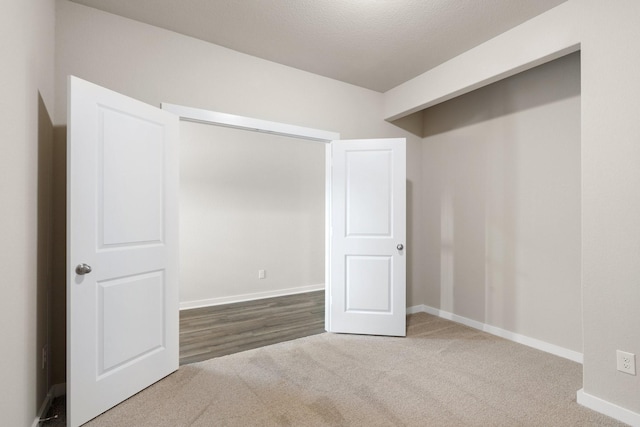 interior space with carpet flooring and a textured ceiling