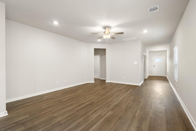 unfurnished room with ceiling fan and dark hardwood / wood-style floors