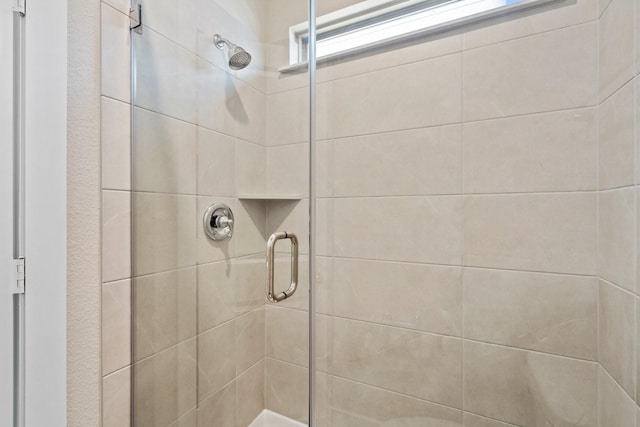 bathroom featuring an enclosed shower