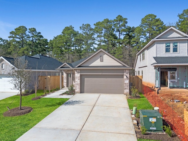 view of front of home with a front lawn and a garage