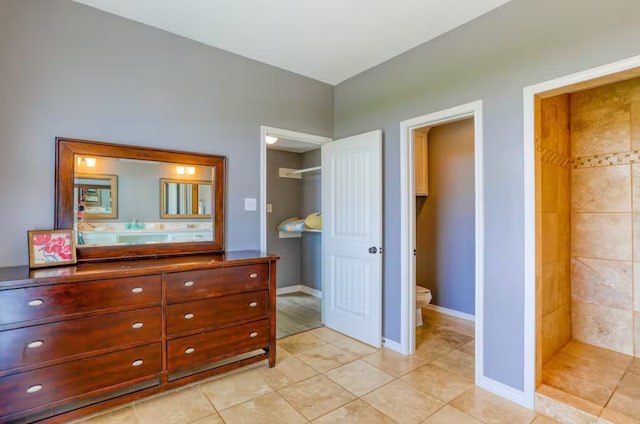 bathroom with vanity, toilet, and tile patterned floors