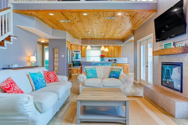 living room featuring wooden ceiling and light hardwood / wood-style floors