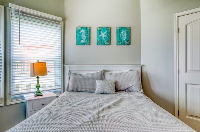 bedroom with multiple windows