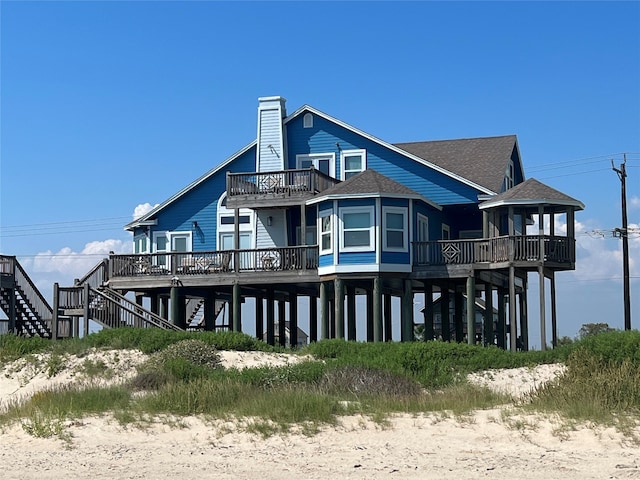 back of property featuring a deck