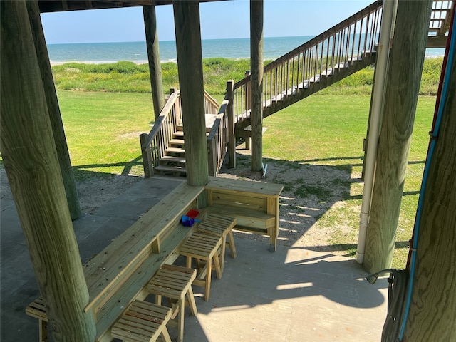 view of patio with a water view