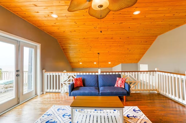 living room with wood-type flooring, wooden ceiling, vaulted ceiling, and a healthy amount of sunlight