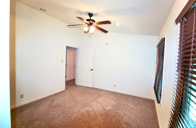 unfurnished bedroom with ceiling fan, carpet floors, and vaulted ceiling