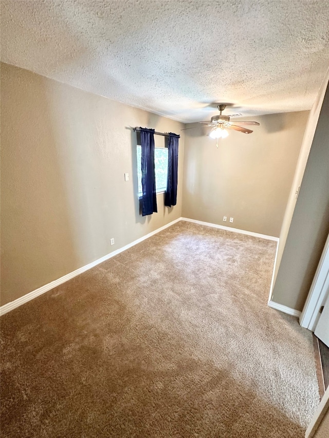 unfurnished room with carpet, a textured ceiling, and ceiling fan