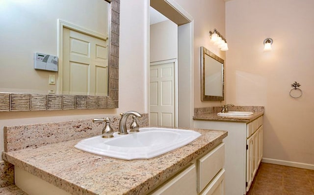 bathroom with tile patterned flooring and vanity