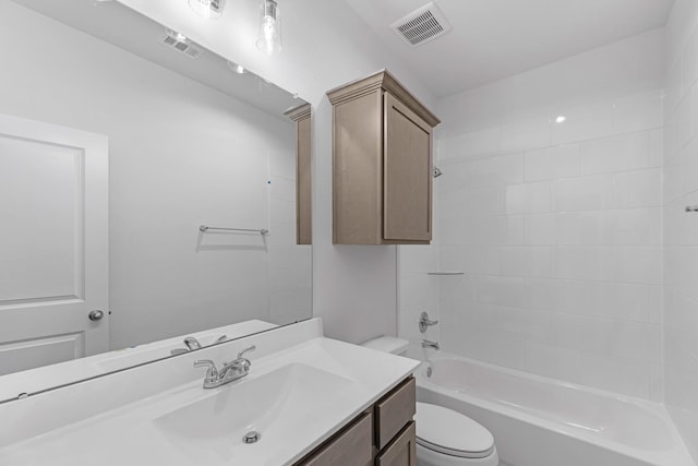 full bathroom featuring vanity, toilet, and washtub / shower combination