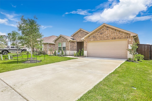 view of front of house featuring a front yard and a garage