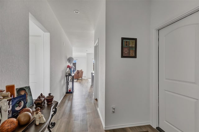 hall with light wood-type flooring