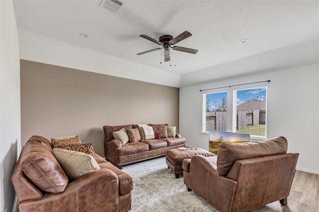 living room with ceiling fan and light wood-type flooring