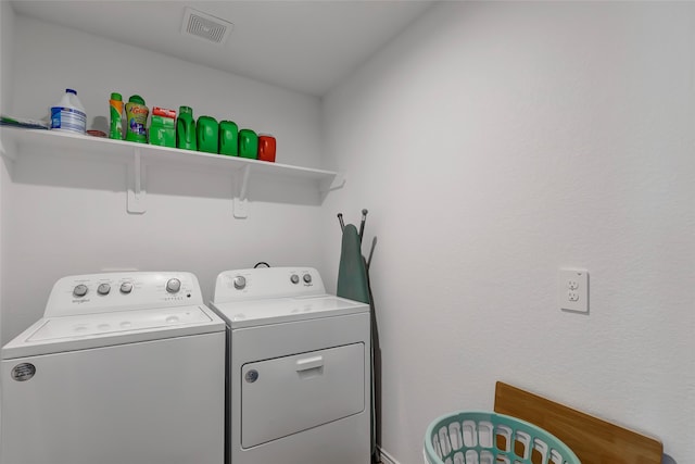 laundry area with washing machine and dryer