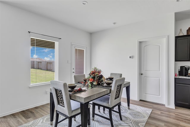 dining space featuring light hardwood / wood-style floors