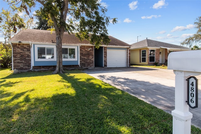 single story home featuring a front lawn and a garage