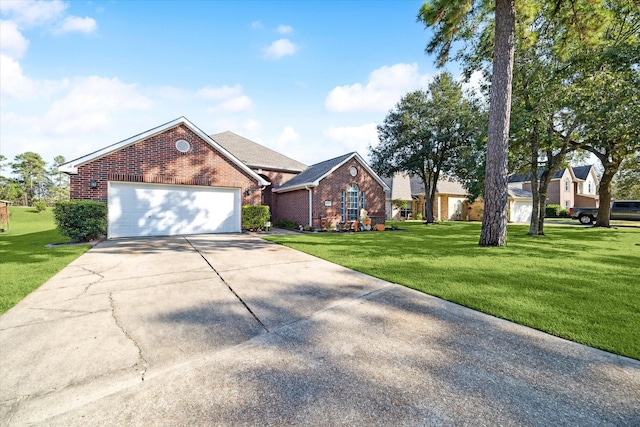 view of front facade with a front yard and a garage