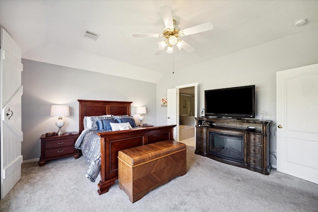 bedroom featuring ceiling fan, light colored carpet, and vaulted ceiling