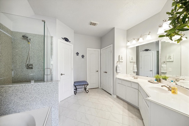 bathroom featuring separate shower and tub and vanity