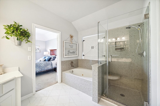 bathroom featuring vanity, separate shower and tub, and vaulted ceiling