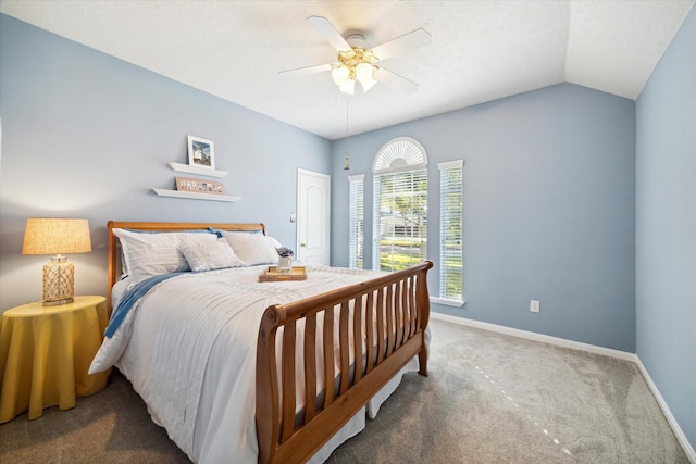 carpeted bedroom with vaulted ceiling and ceiling fan