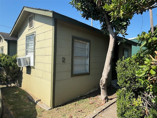 view of side of home with cooling unit