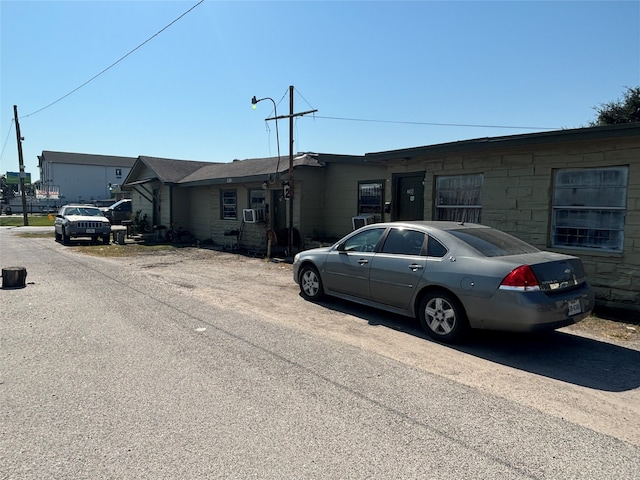 ranch-style house featuring cooling unit