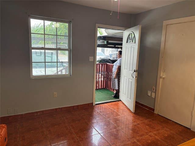 1612 Houston Blvd Unit 16, South Houston, TX 77587 - unfurnished dining area with baseboards and tile patterned floors