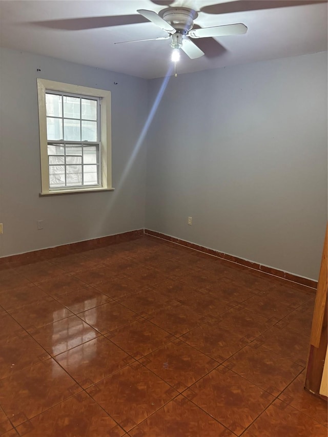 1612 Houston Blvd Unit 16, South Houston, TX 77587 - empty room featuring dark tile patterned floors and a ceiling fan