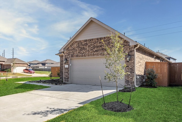 view of front of house featuring a front yard and a garage