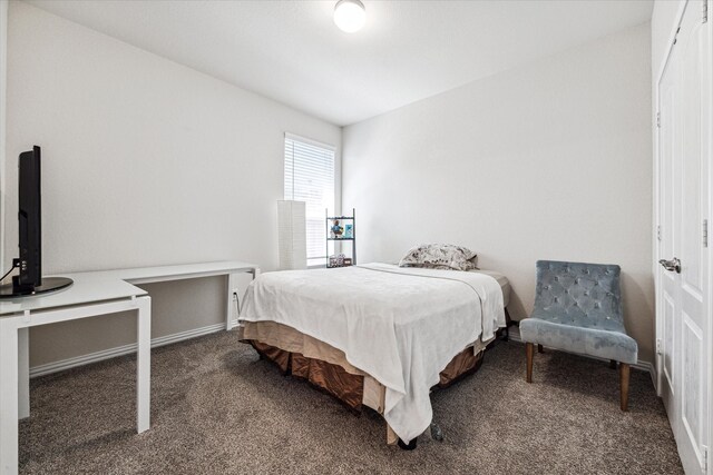 carpeted bedroom with lofted ceiling