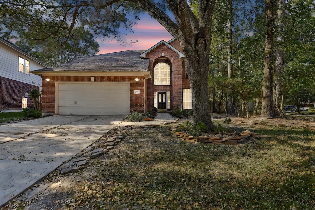 view of front of home with a garage