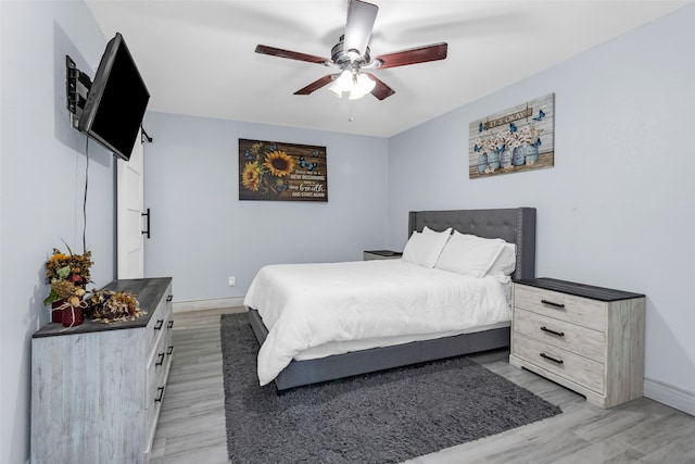 bedroom featuring ceiling fan and light hardwood / wood-style flooring