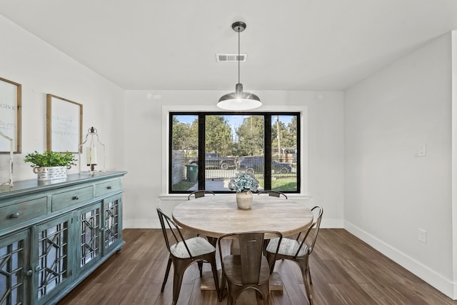 dining room with dark hardwood / wood-style floors