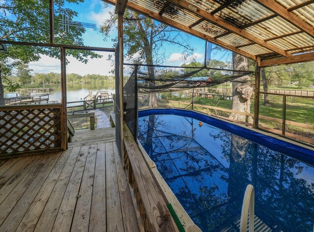 view of pool featuring a water view